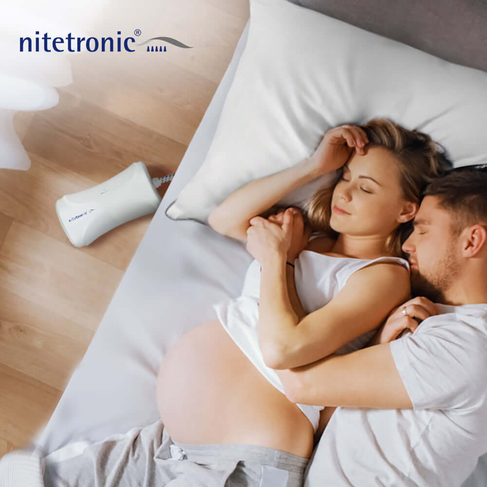 Pregnant woman resting with anti-snoring device, promoting healthy sleep during pregnancy.