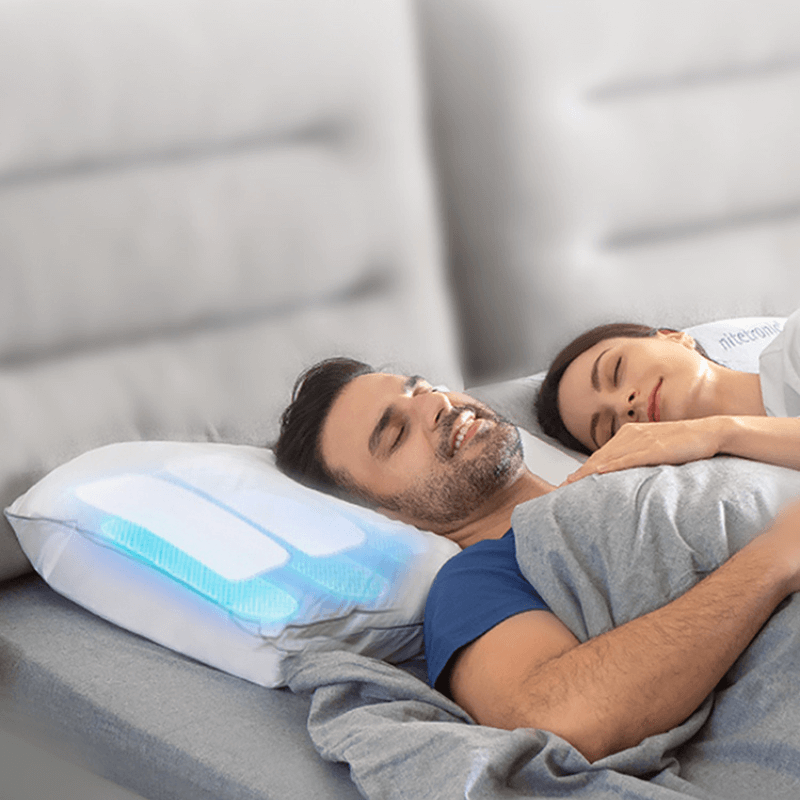 Couple sleeping peacefully with Nitetronic Z6 Anti-Snore Pillow, showcasing innovative anti-snoring technology for better sleep.