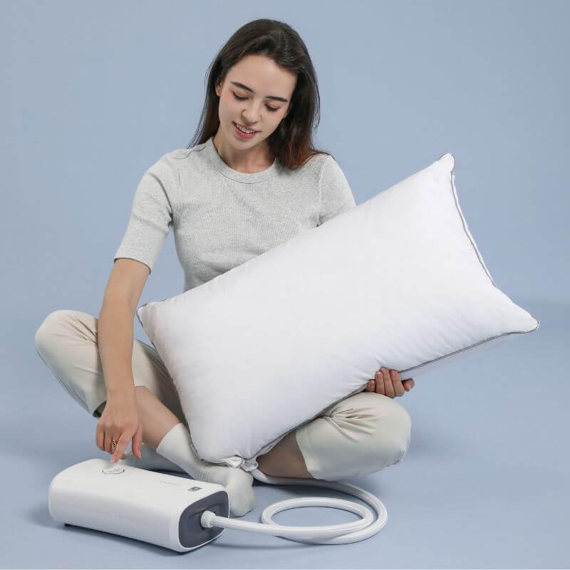 Woman demonstrating the Nitetronic Z6 anti-snoring pillow, highlighting innovative solutions for improved sleep.