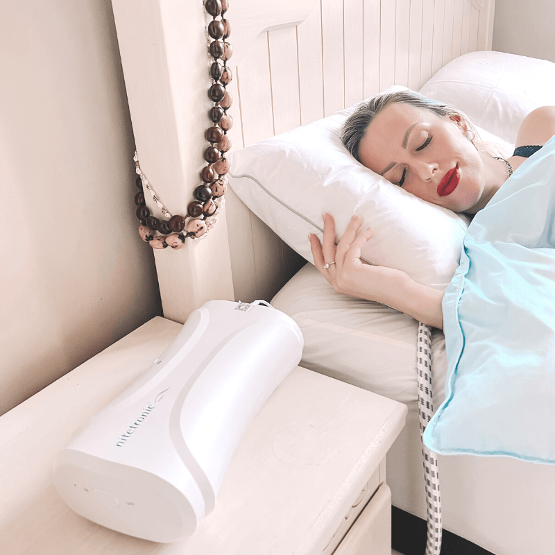 Woman sleeping peacefully with an anti-snore pillow, showcasing the effectiveness of anti-snore pillows in reducing snoring for better sleep.