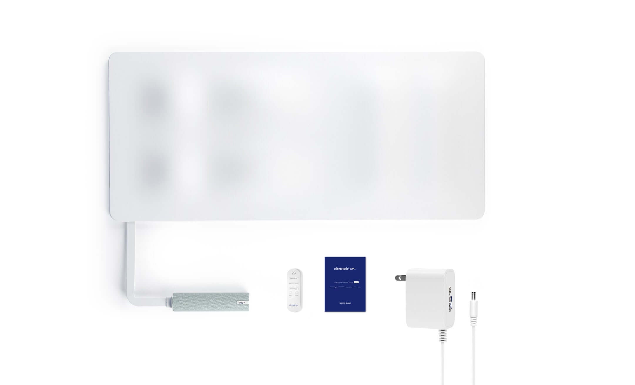 Smart home automation device kit with wall panel, remote, manual, and power adapter on a white background.