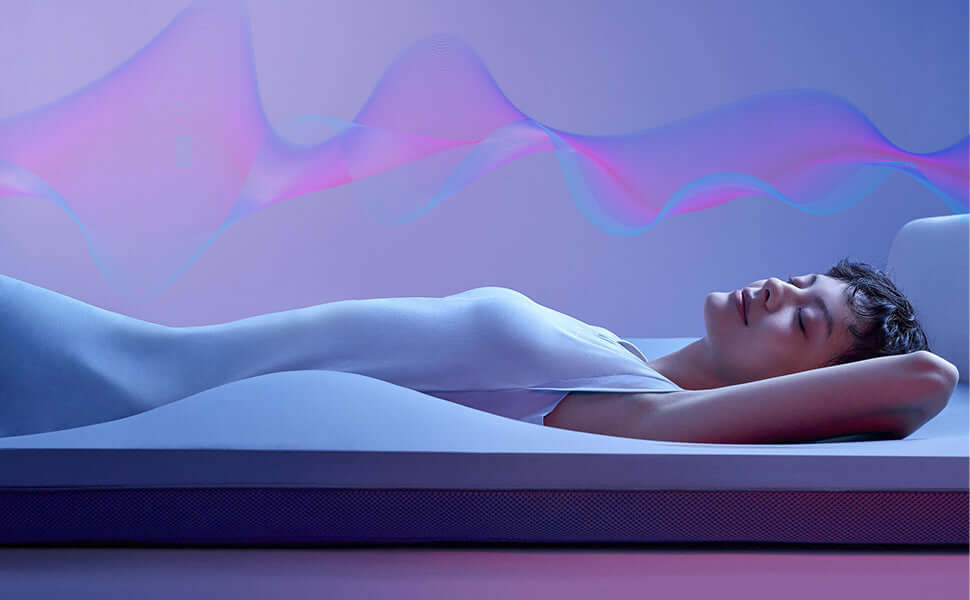 Person relaxing on a modern mattress with colorful waves, conveying comfort and innovation.