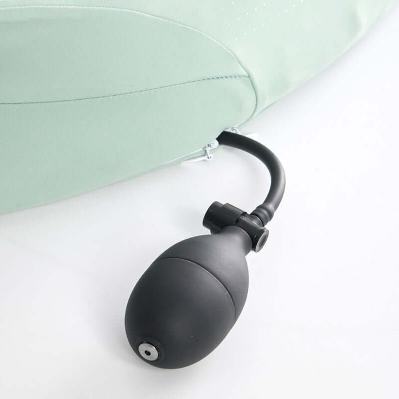 Inflatable cushion with black air pump attached for adjustable comfort and support.