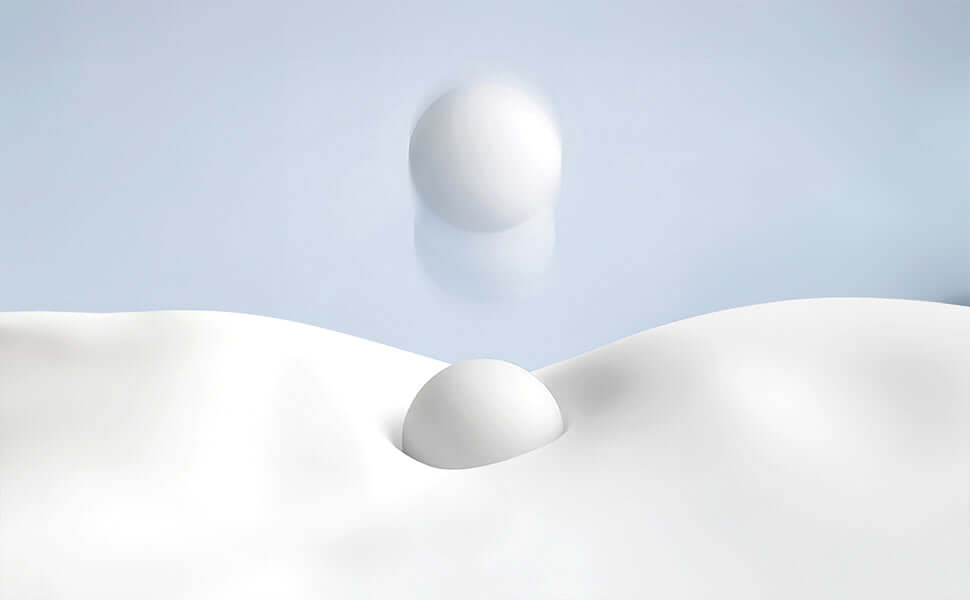 Abstract white sphere on a smooth, snowy surface with a pastel blue background, creating a minimalist and serene visual.