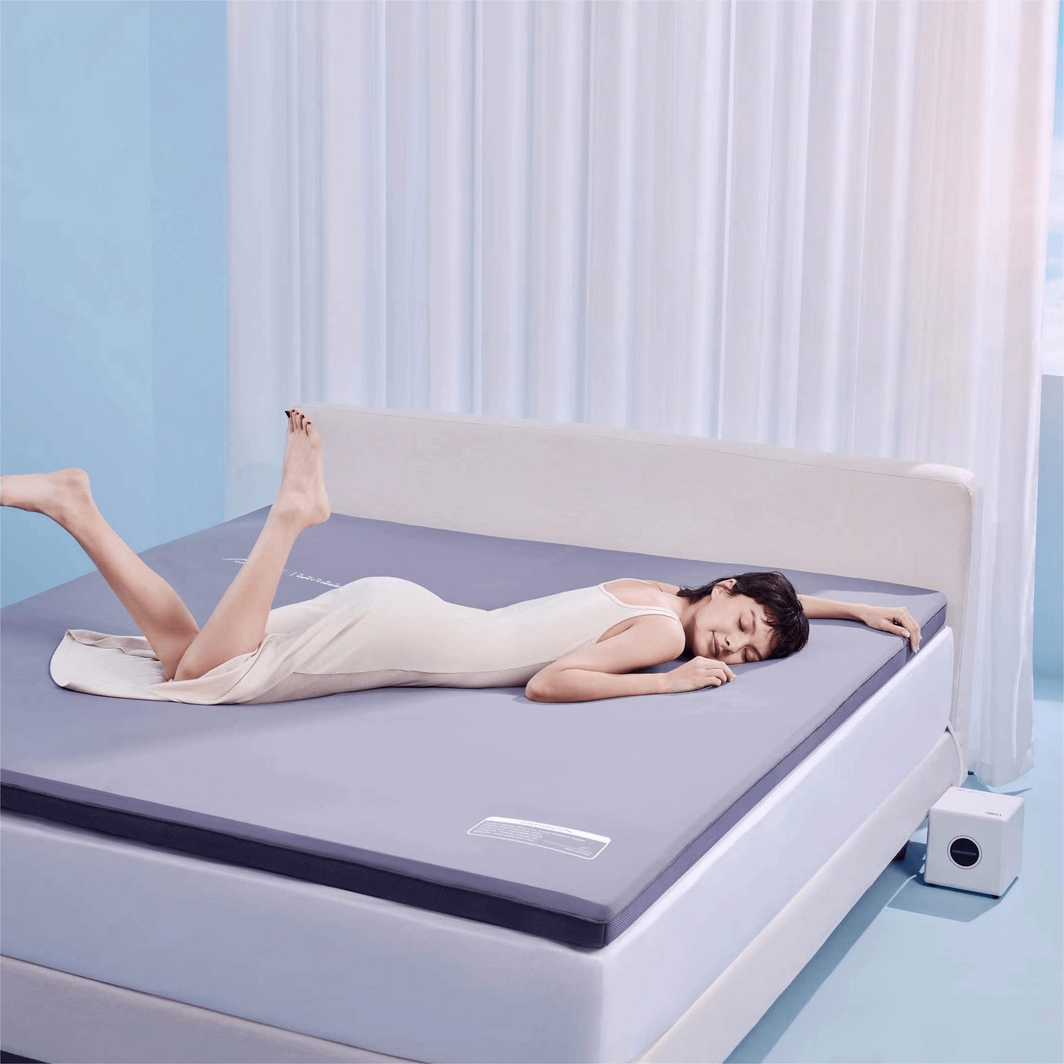 Woman relaxing on a modern memory foam mattress in a stylish bedroom
