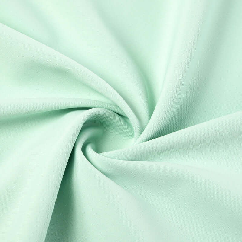 Mint green fabric close-up, featuring soft texture and elegant swirl design, ideal for Nitetronic Pillowcase for H02.