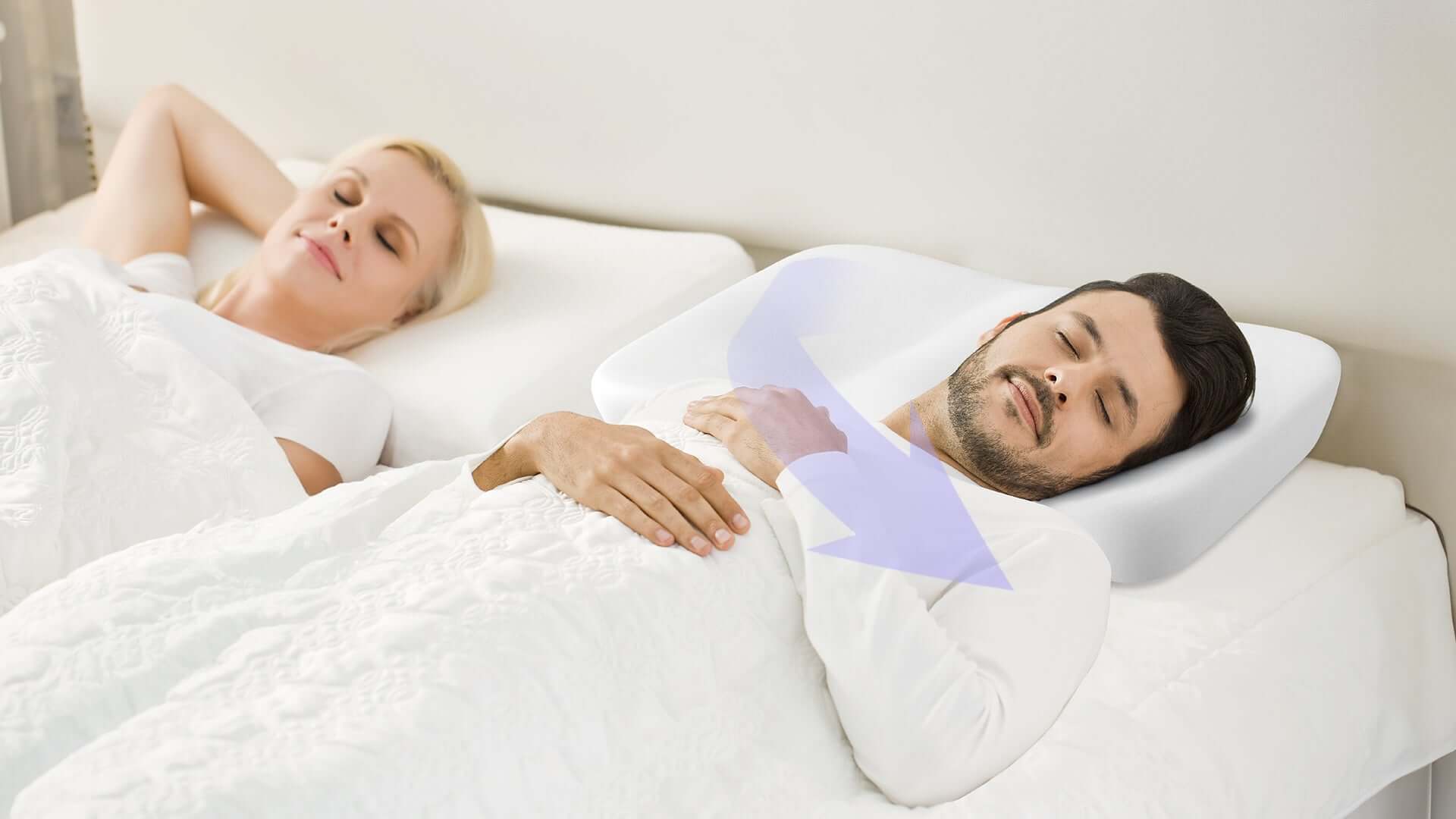 Man sleeping soundly on Nitetronic Z10 anti-snore pillow with ergonomic design and high-elastic spandex cover.