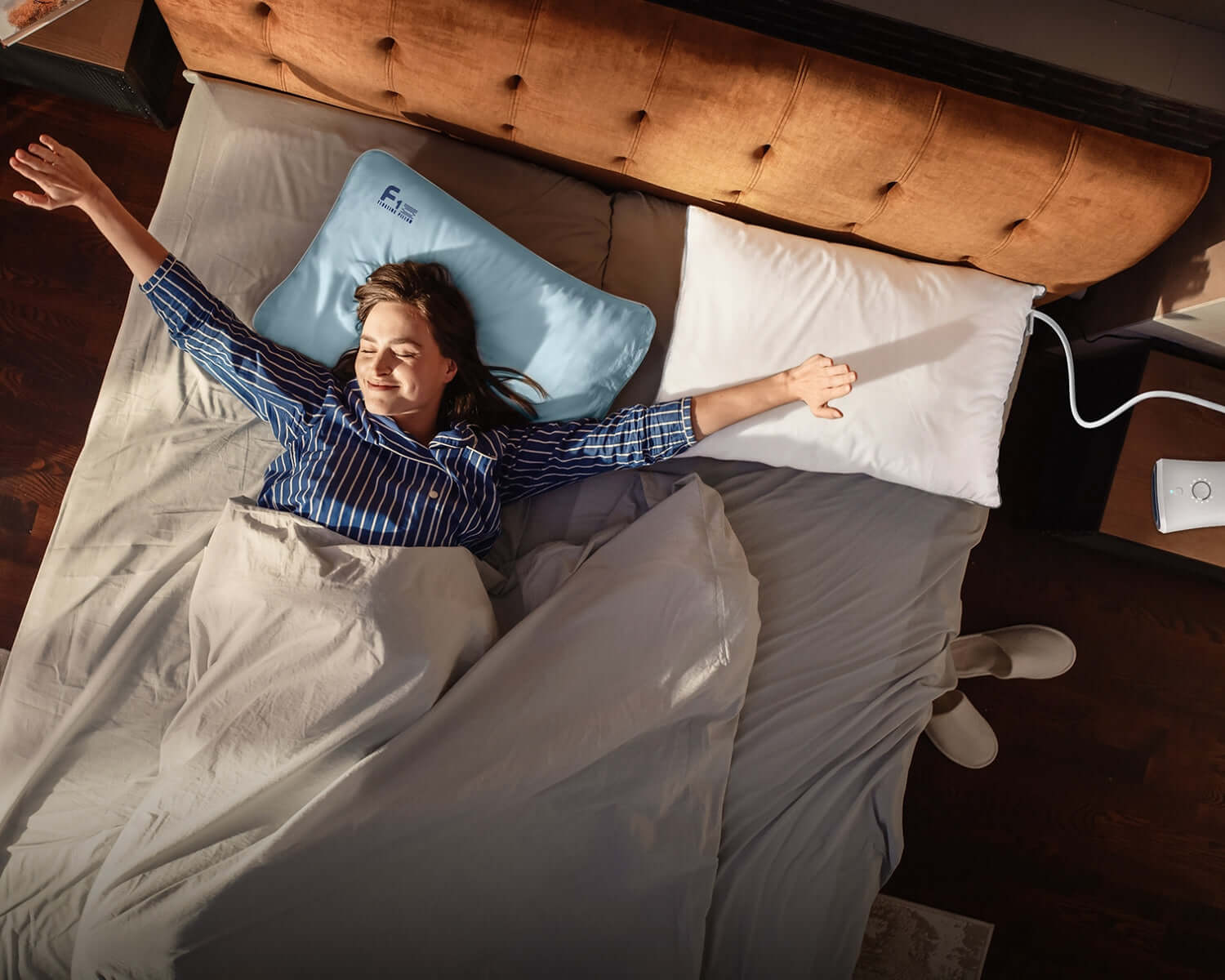 Woman waking up refreshed using Nitetronic Z6 CPAP Pillow for snoring relief