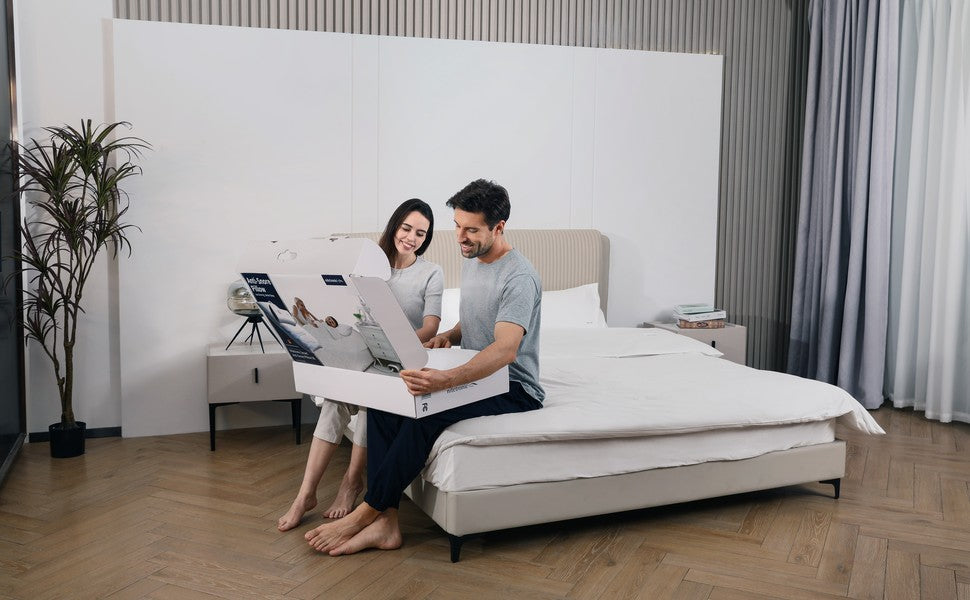 Couple reviewing a Nitetronic Z6 pillow together on a bed