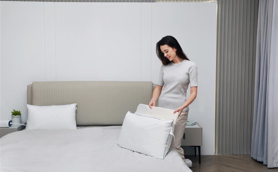 Sleeper using a Nitetronic Z6 smart anti-snore pillow in a real bedroom setup